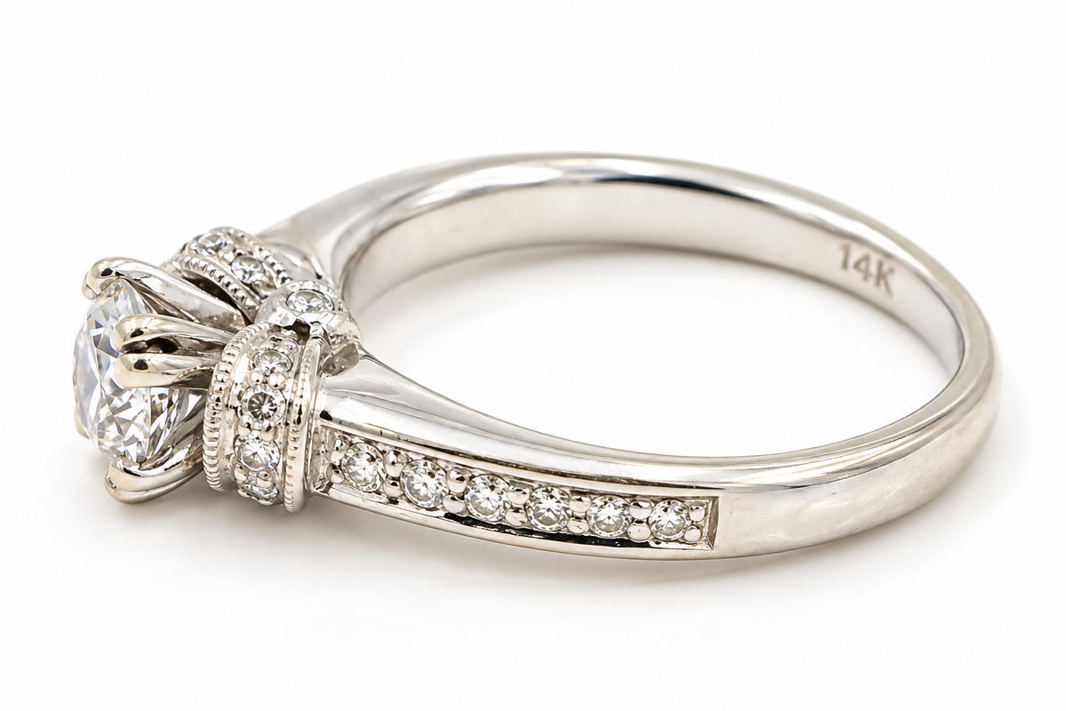 Estate 14k White Gold Diamond High Setting Wedding/Engagement Ring with a large center diamond and smaller side diamonds.