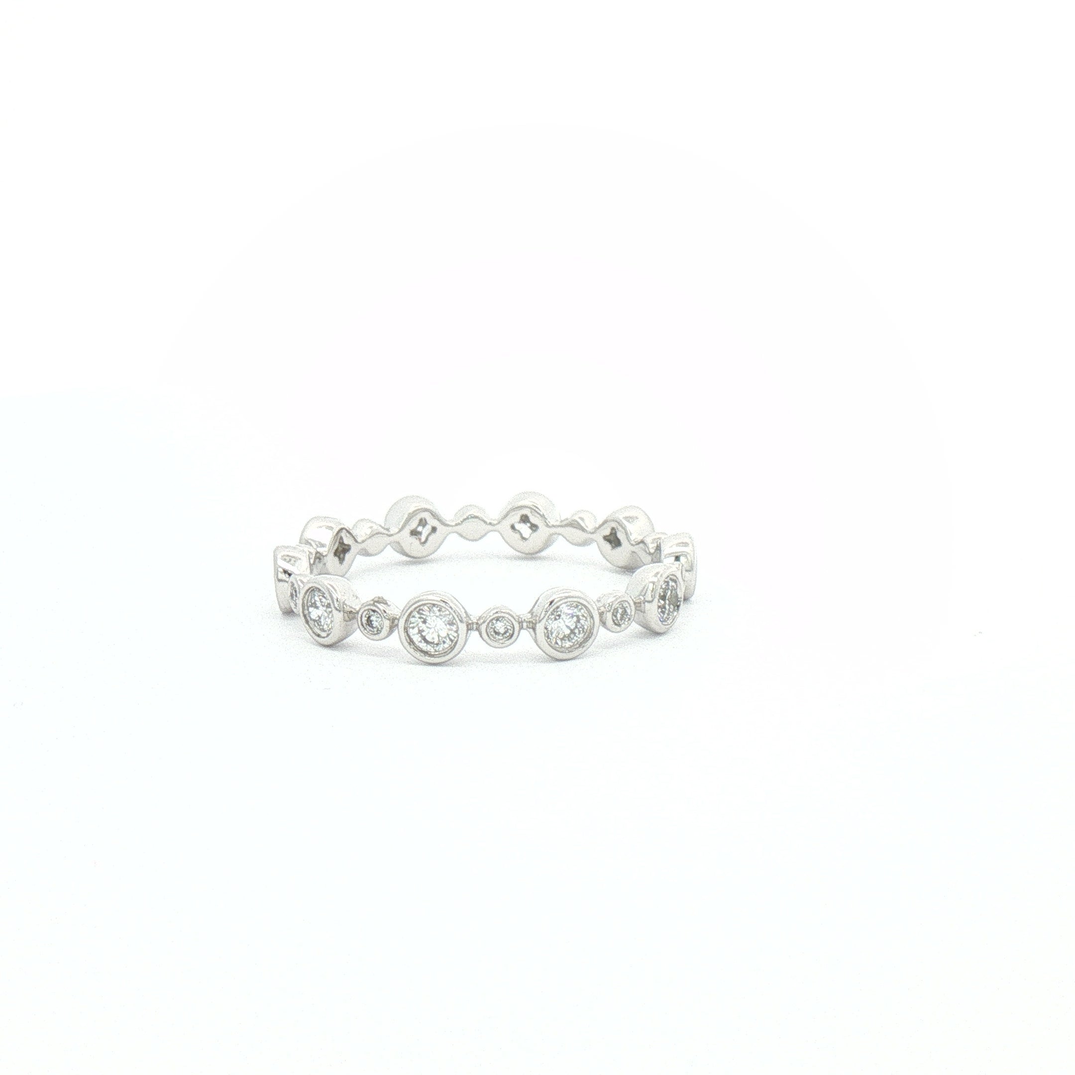 White gold bezel-set diamond band.