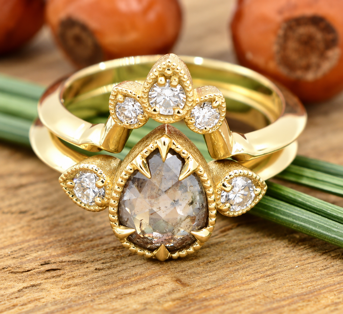 Kent Island Jewelry Estate 14k Yellow Gold Salt & Pepper Diamond Wedding Set with a pear-shaped center and diamond halo.
