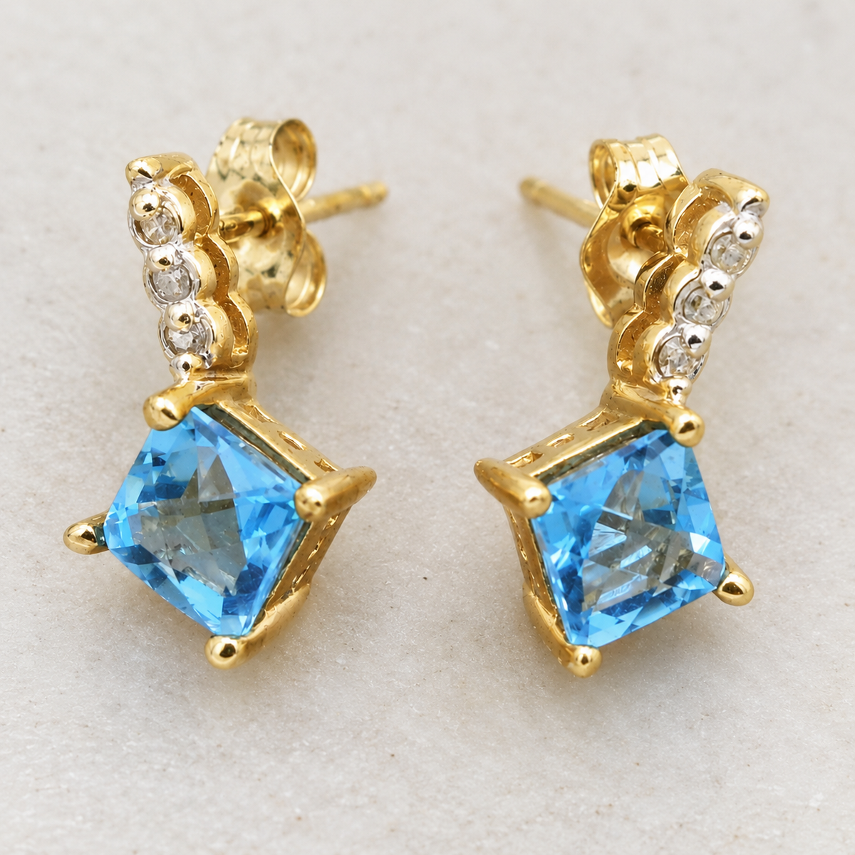 Kent Island Jewelry 10k Yellow Gold White Sapphire & Blue Spinel dangle earrings with a square-cut blue spinel and sapphires.