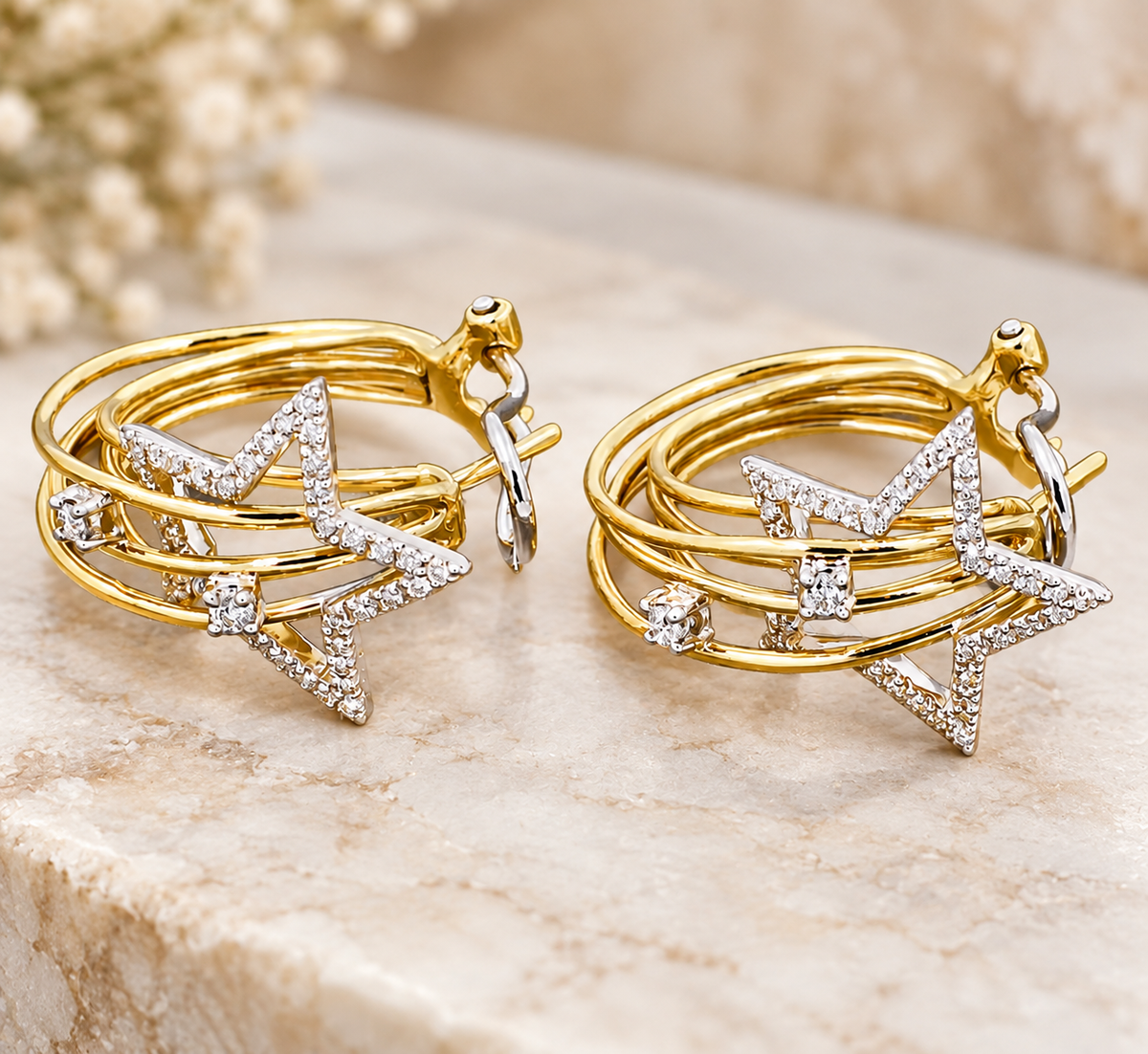 14k Yellow & White Gold Designer Sonia B Diamond Star Omega Back earrings featuring multi-layered bands.