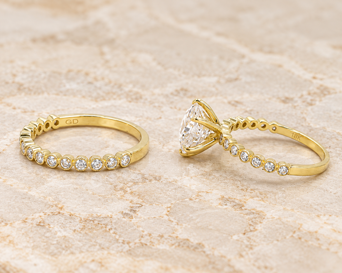 18k Yellow Gold Moissanite Wedding Engagement Set featuring a large center stone and matching pave bands in yellow gold.