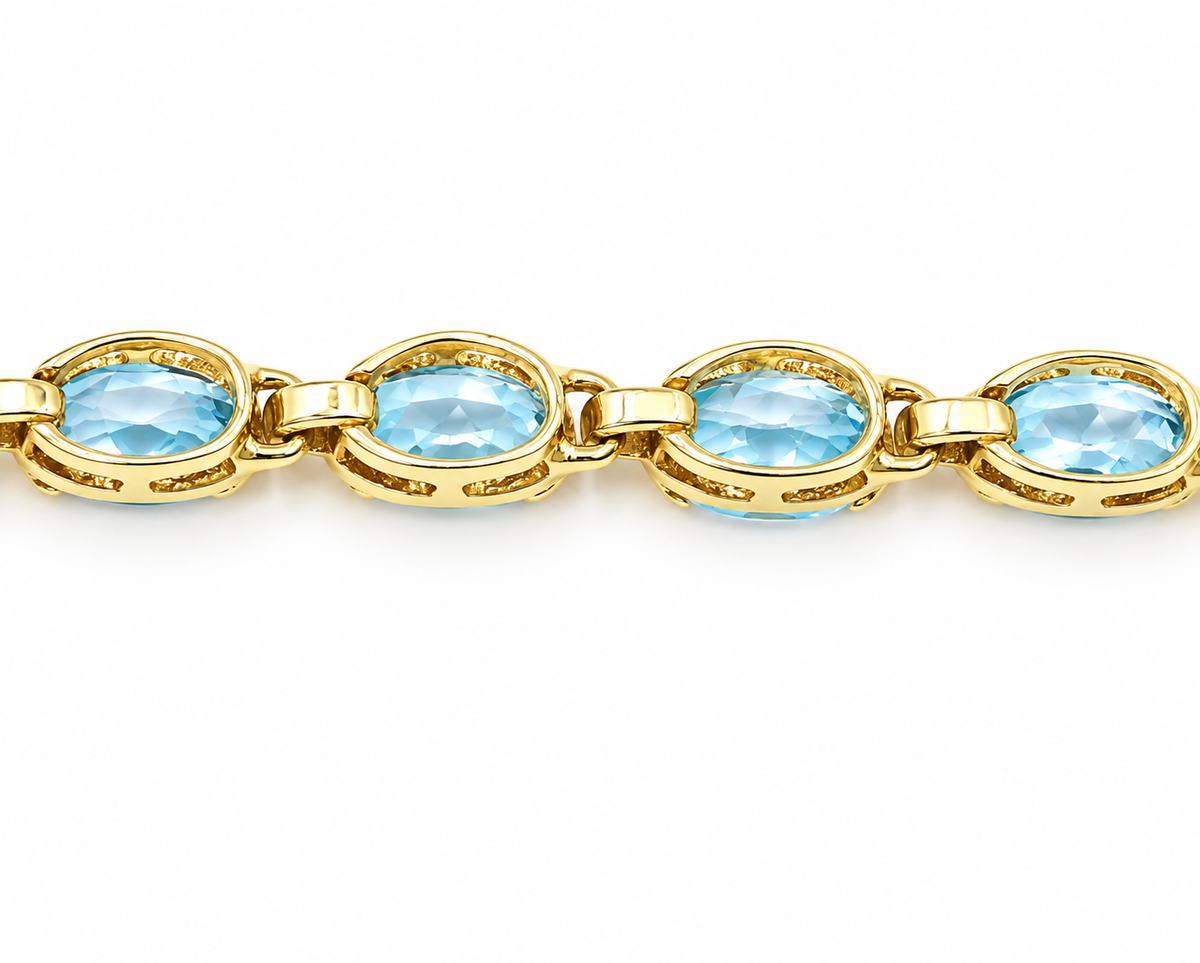 Kent Island Jewelry Estate 14k Yellow Gold Blue Topaz Gemstone Chain Link Tennis Bracelet with a row of oval blue topaz.