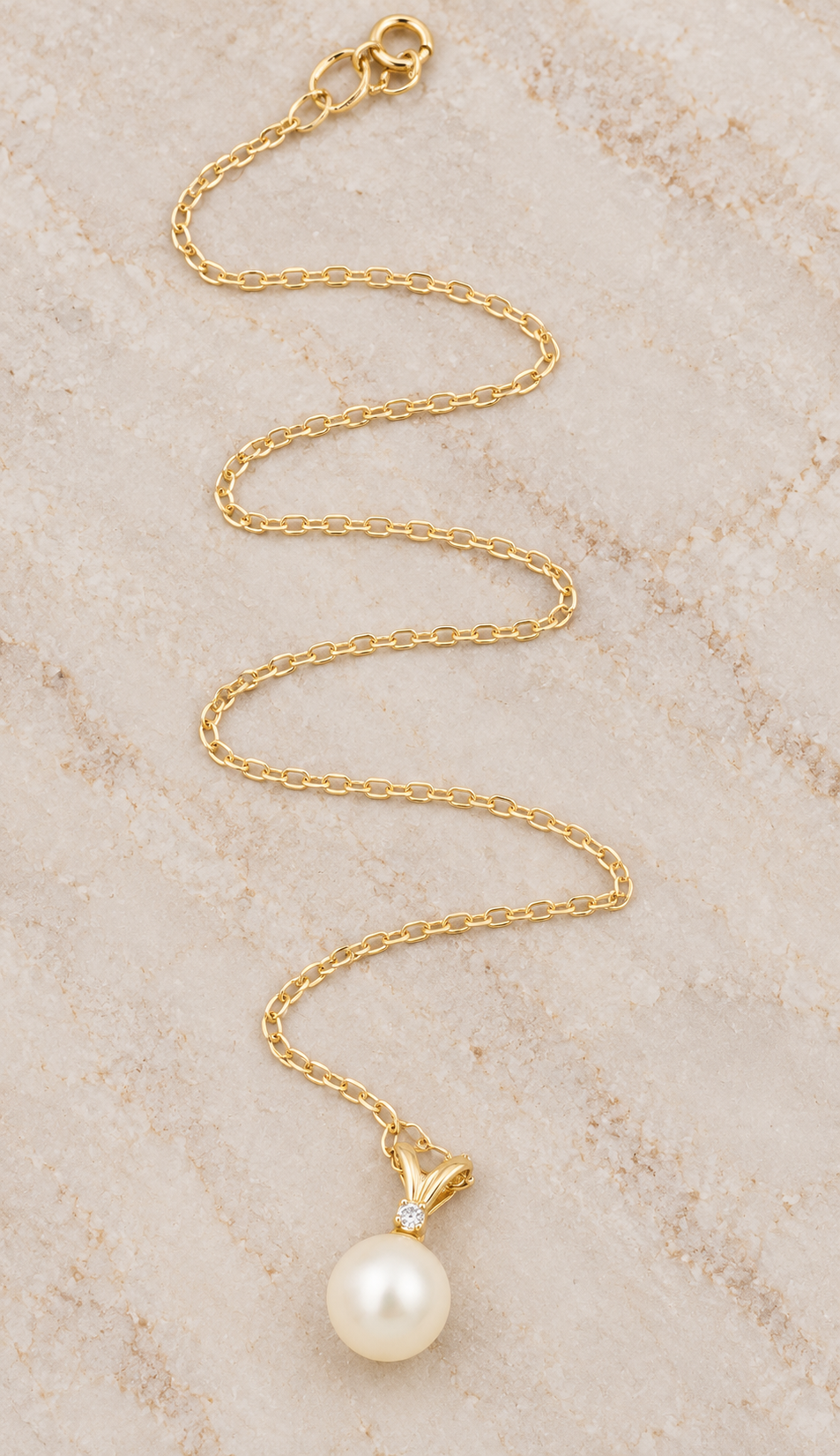 Kent Island Jewelry Estate 14k Yellow Gold Diamond & Pearl cable chain necklace with a pearl pendant topped by a diamond.