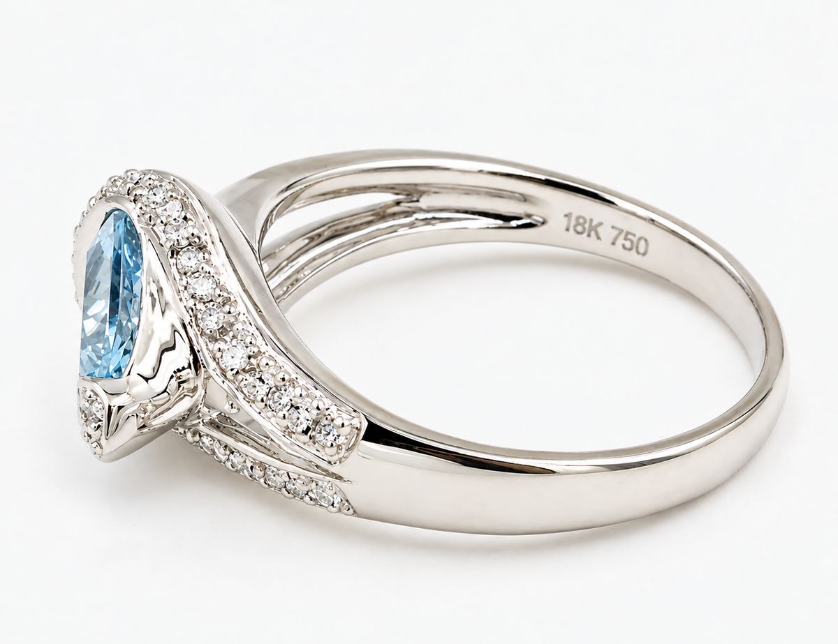 Kent Island Jewelry Estate 18k White Gold Diamond & Aquamarine Gemstone Ring with a pear-shaped aquamarine and diamonds.