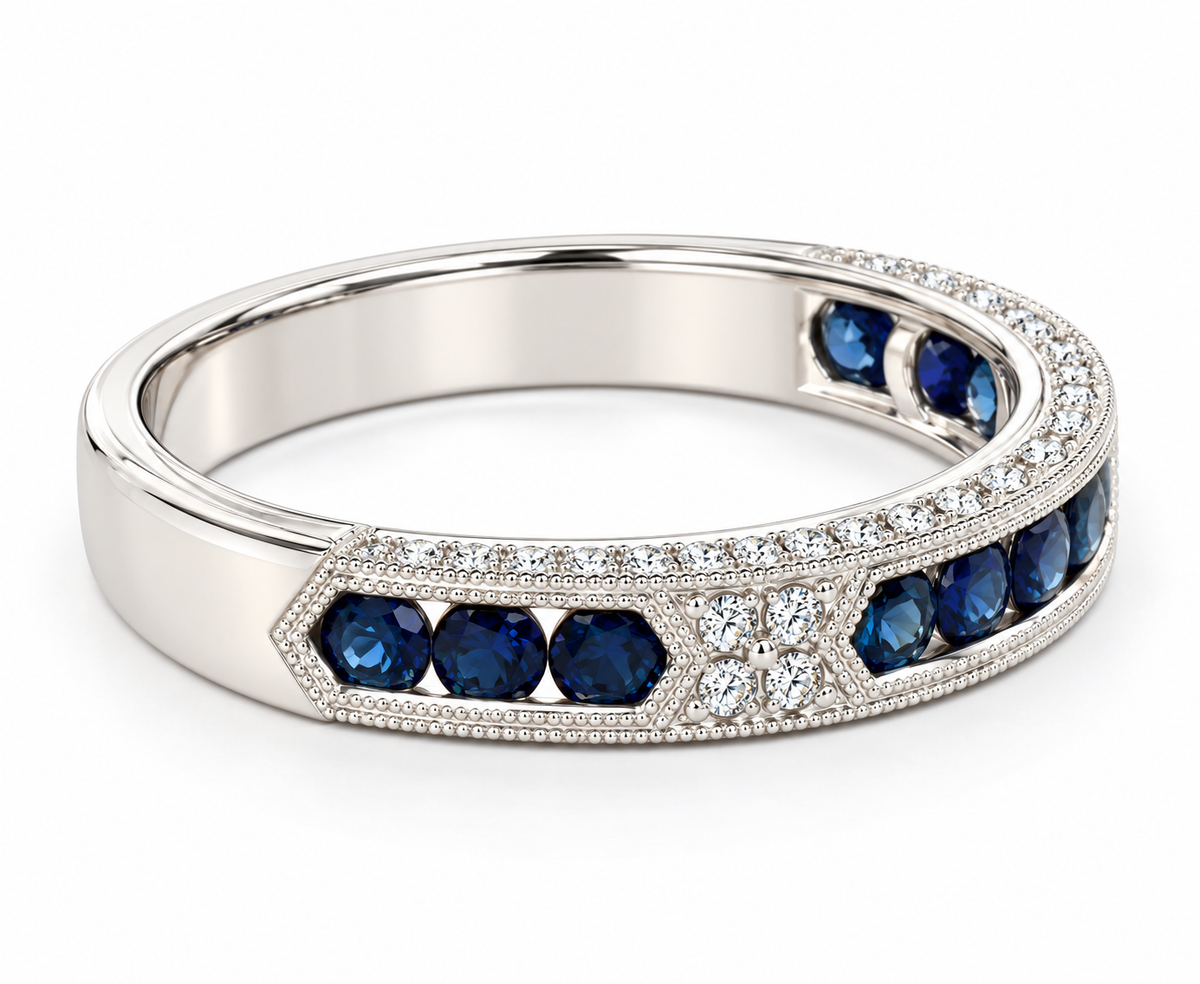 A white gold ring featuring round-cut deep blue sapphires and pavé-set clear stones, shown on a clean white background.