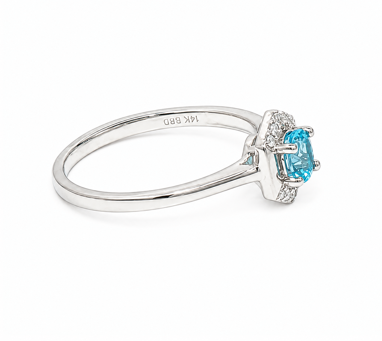 A white gold 14K ring featuring a central light blue emerald-cut gemstone surrounded by small clear accent stones, shown on a clean white background.