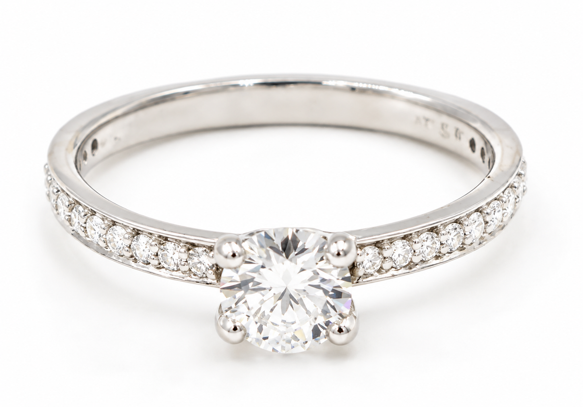 Kent Island Jewelry Estate Platinum .75 tcw Diamond Solitare Ring With Accents, a round diamond solitaire on a pavé band.