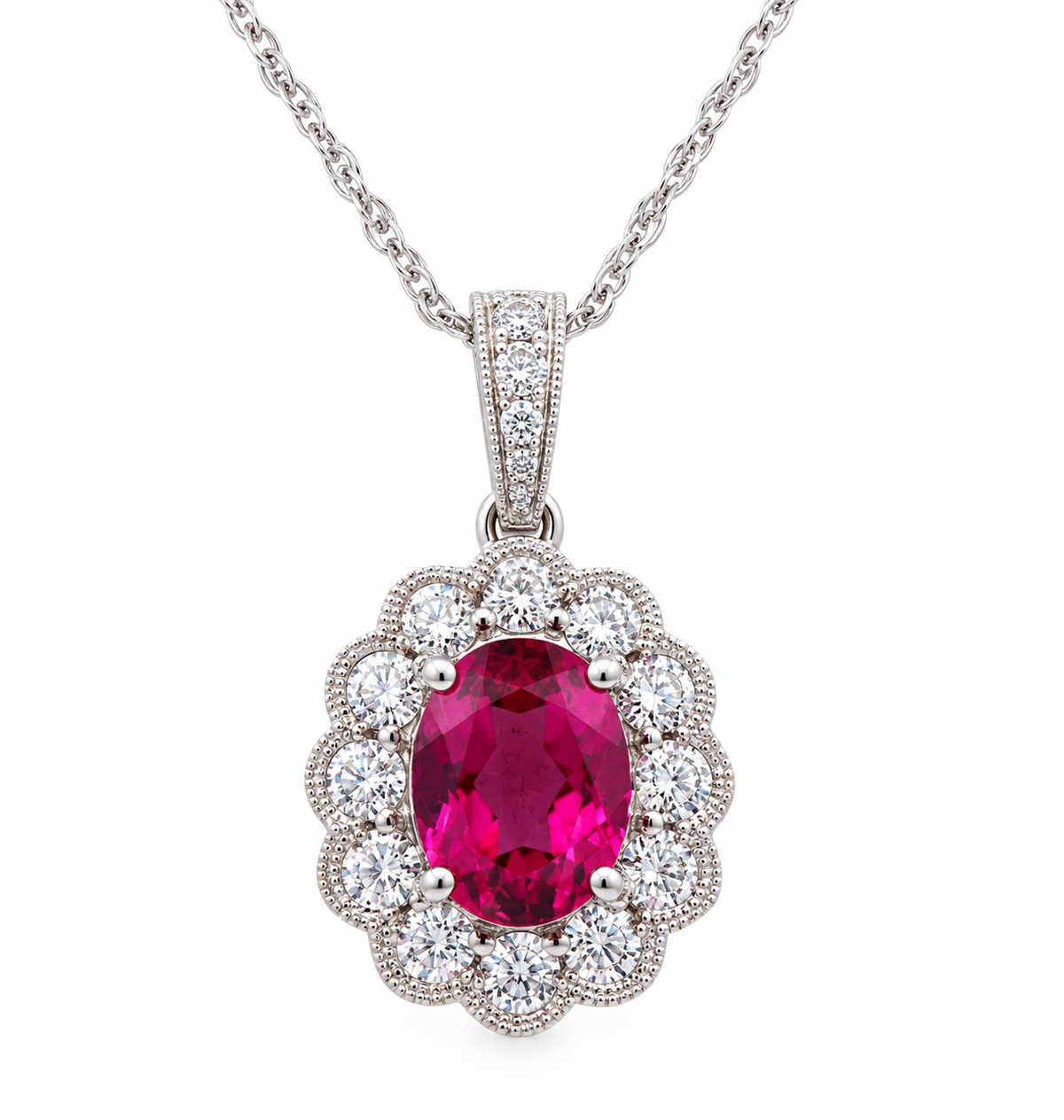 Kent Island Jewelry’s 18K white gold pendant features pink tourmaline & diamond halo in a vintage-inspired necklace.