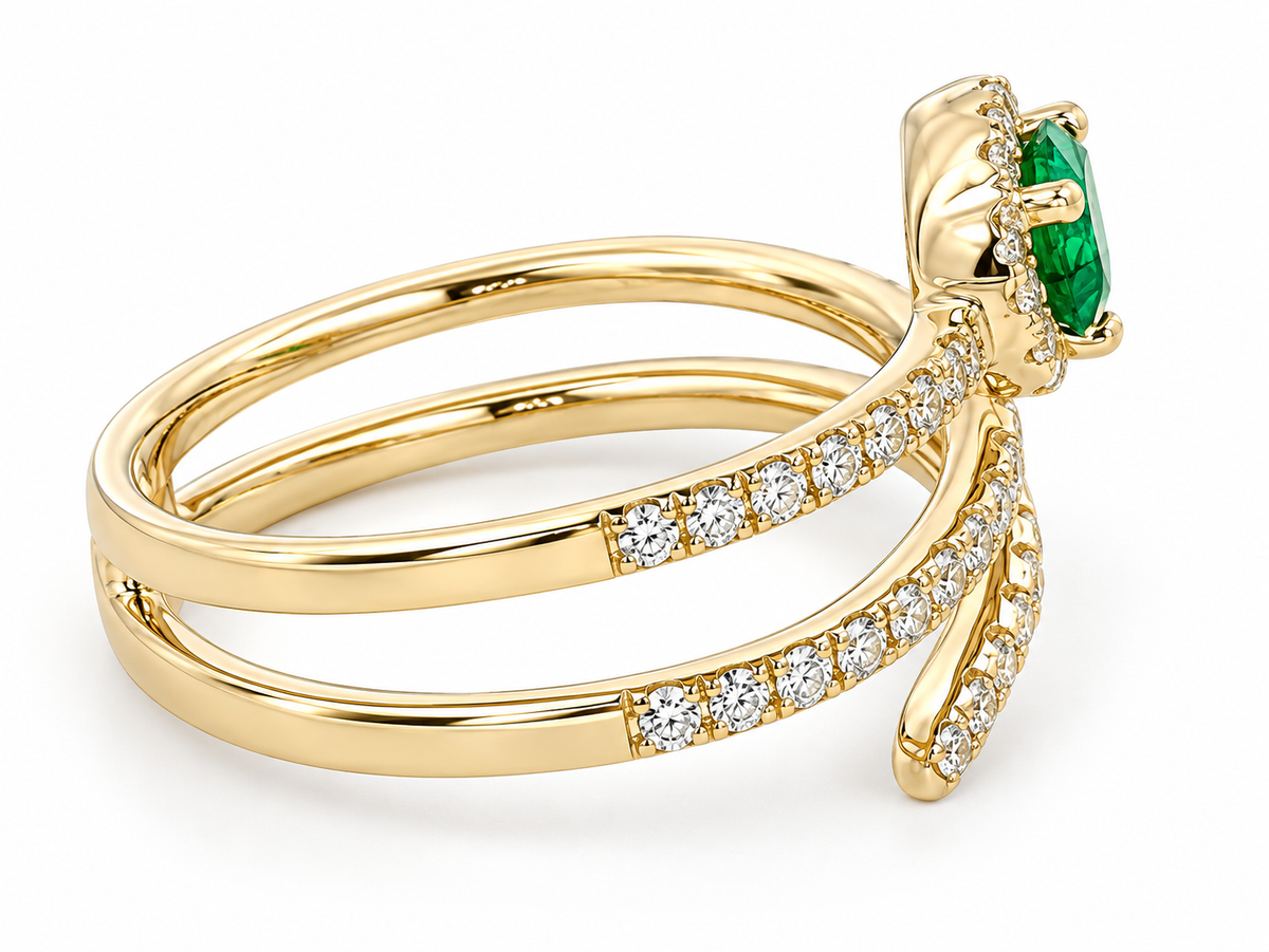 A yellow gold ring with a multi-band design, featuring a green emerald-cut center stone and pavé-set round diamonds along the band, shown on a white background.