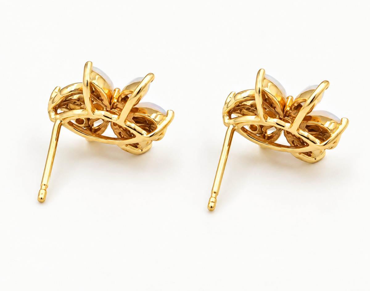 Back view of Estate 14k Yellow Gold Diamond & Fire Opal Gemstone Flower Studs with white cabochon gemstones.