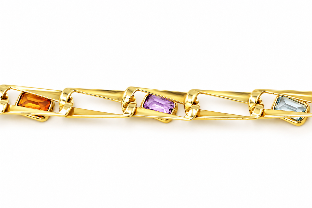Kent Island Jewelry 14k Yellow Gold Peridot Garnet Amethyst Citrine & Spinel chain link bracelet with rectangular gemstones.