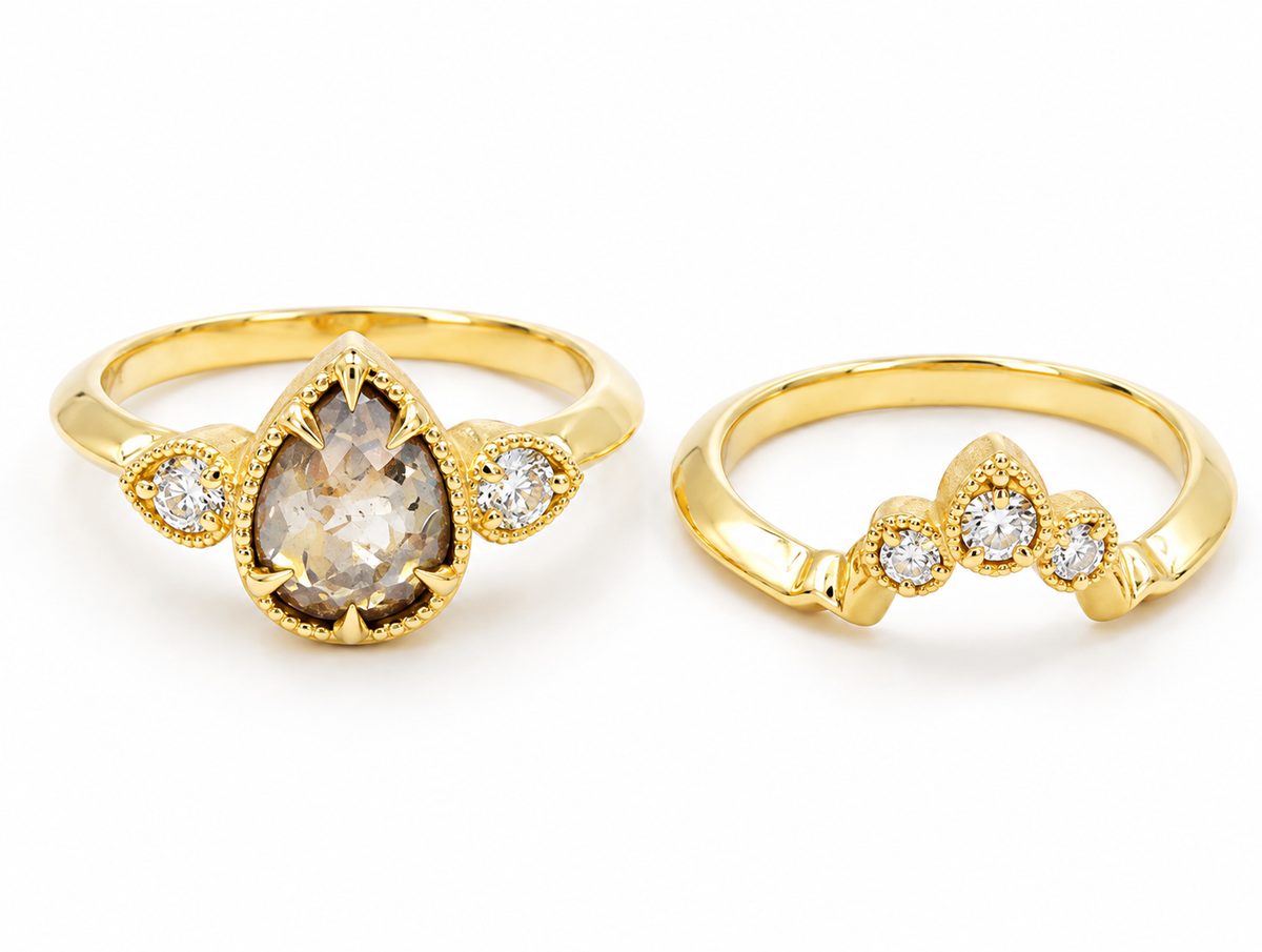 Estate 14k Yellow Gold Salt & Pepper Diamond Wedding Set with a pear-shaped diamond and a chevron band.