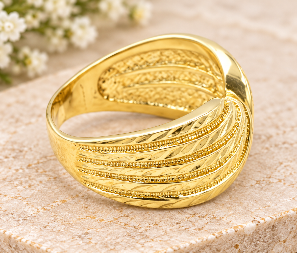 Estate 14k Yellow Gold Diamond Cut Bow Intertwined Ring featuring a textured, intertwined bow design.