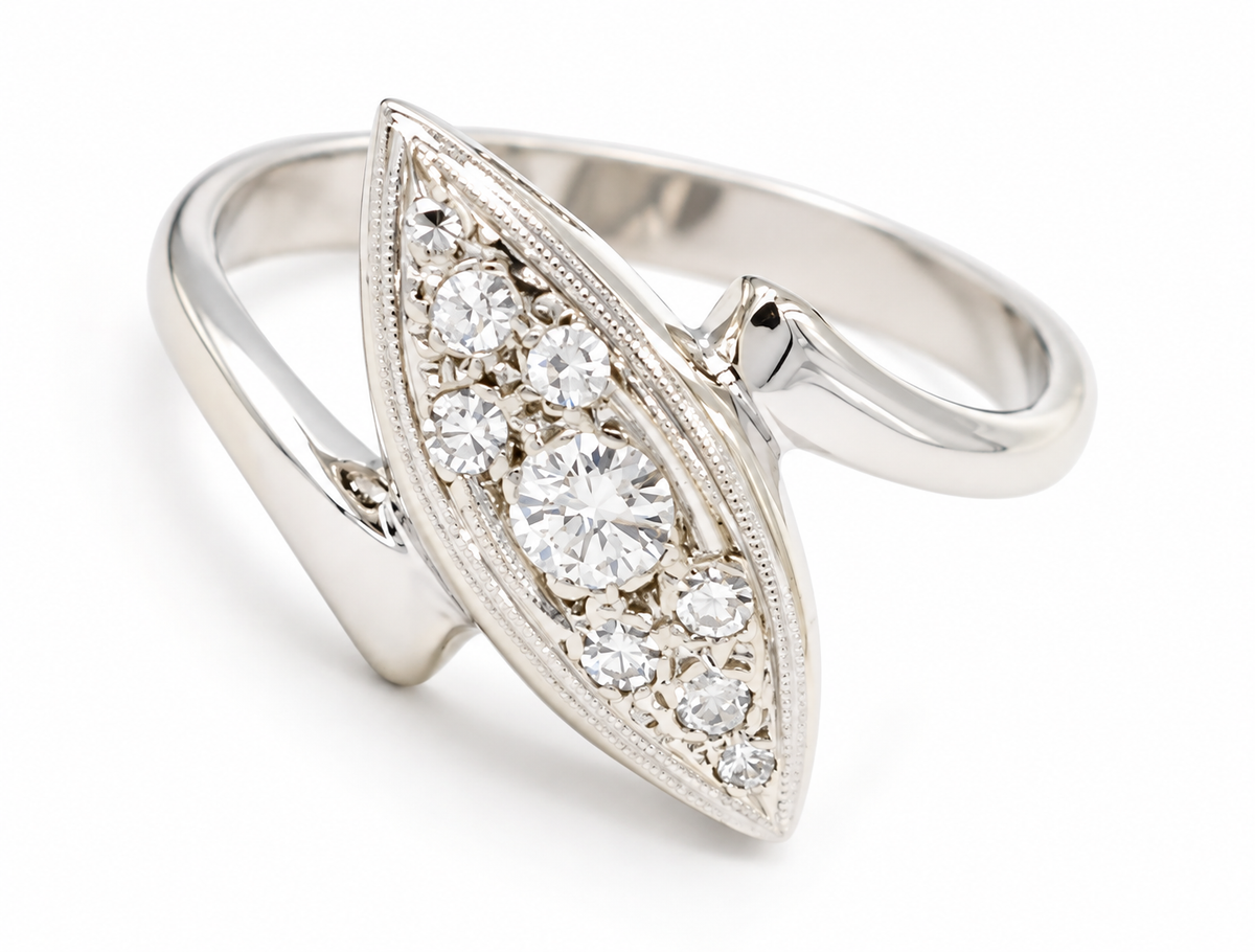 Kent Island Jewelry Estate 14k White Gold Diamond Cocktail Ring in a marquise bypass design with seven round-cut diamonds.