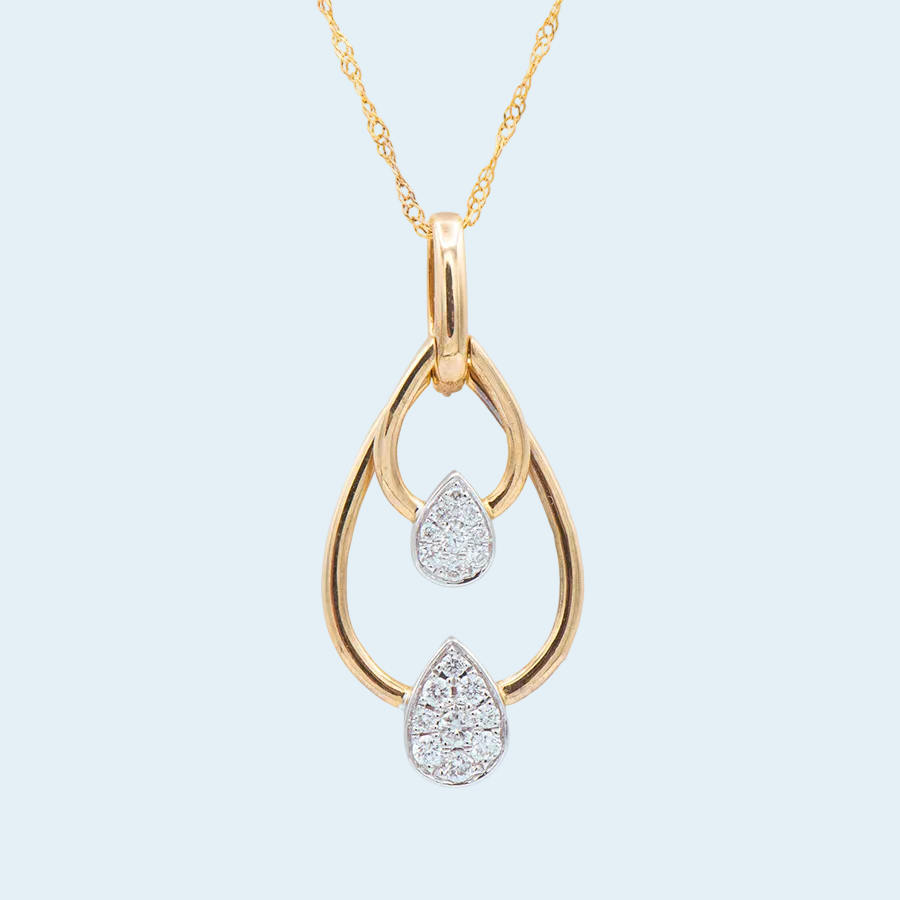 Gold necklace with a teardrop-shaped pendant on a light blue background
