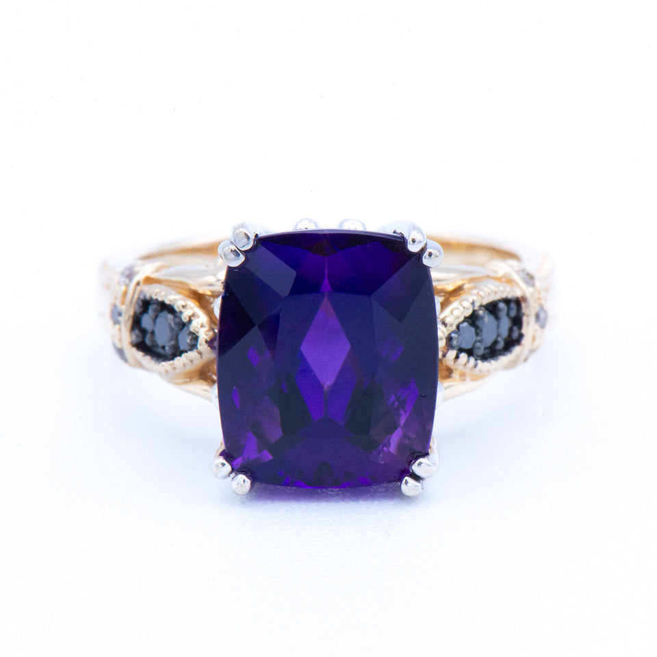 Kent Island Jewelry Estate 14K Two-Tone Amethyst & Sapphire Ring with purple and black stones on white background.