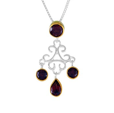 Michou SS P w Garnet features ornate scrollwork and four garnets in gold vermeil settings.