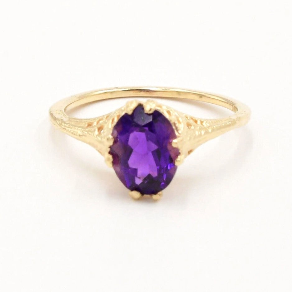 Estate 14k yellow gold amethyst openwork ring by Kent Island Jewelry, featuring a textured design and oval gemstone.