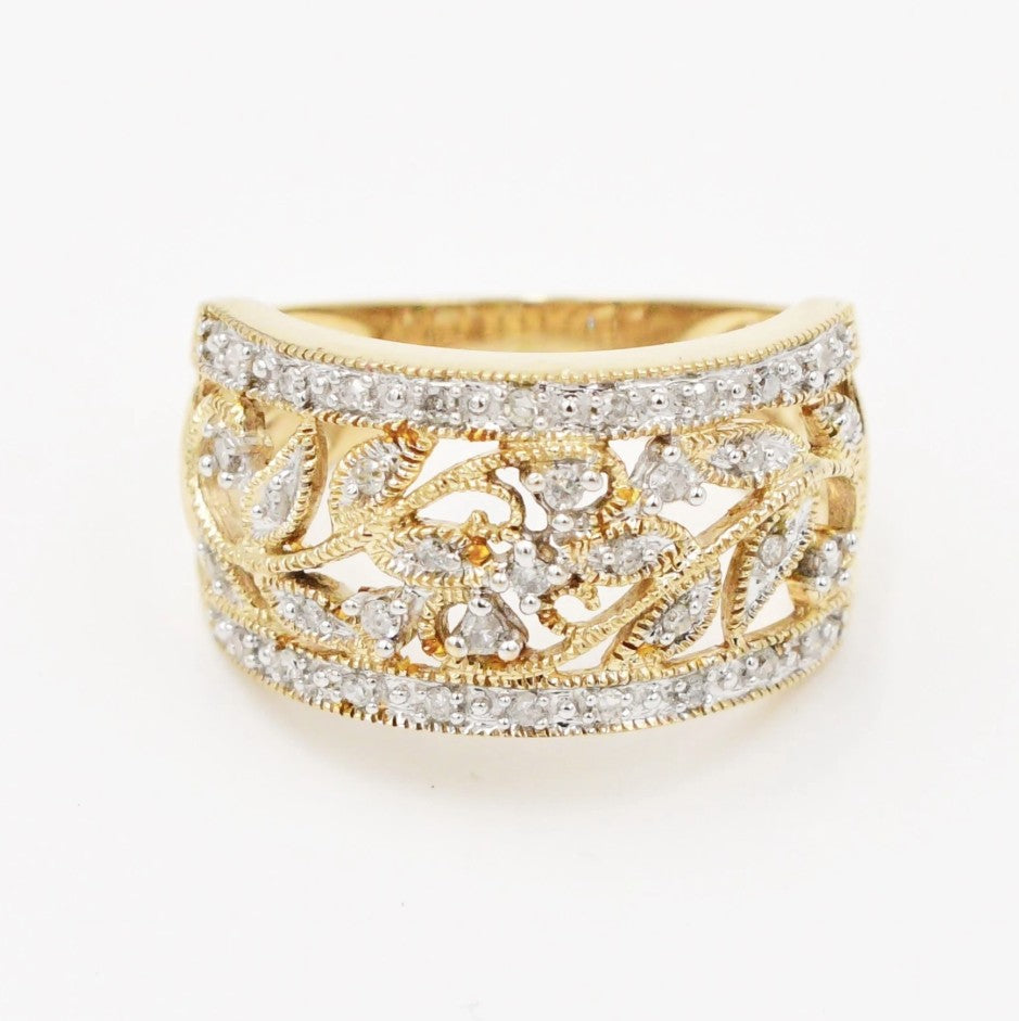 Kent Island Jewelry Estate 10k two-tone ring with .26ctw diamonds, open work band, and delicate floral motifs.