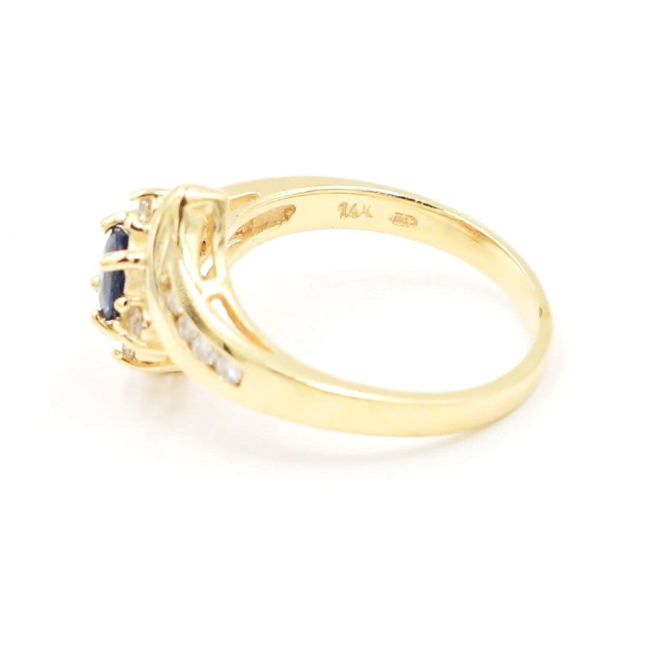 Kent Island Jewelry’s Estate 14k YG ring features a sapphire center and .13 tcw diamonds in a cocktail design.