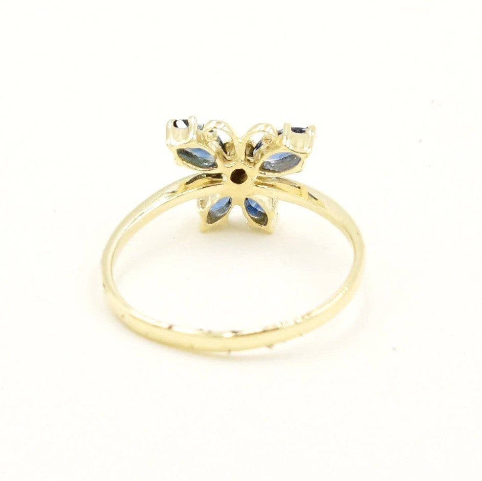 Kent Island Jewelry Estate 14k YG butterfly ring with .01tcw diamond & blue spinel, shown on white background.