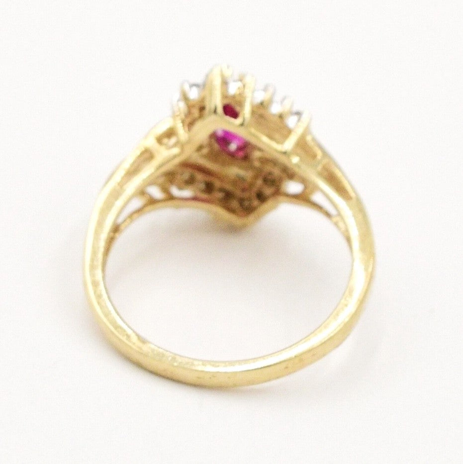 Estate 10k yellow gold diamond (.09 tcw) and ruby ring by Kent Island Jewelry, shown from the back on white.