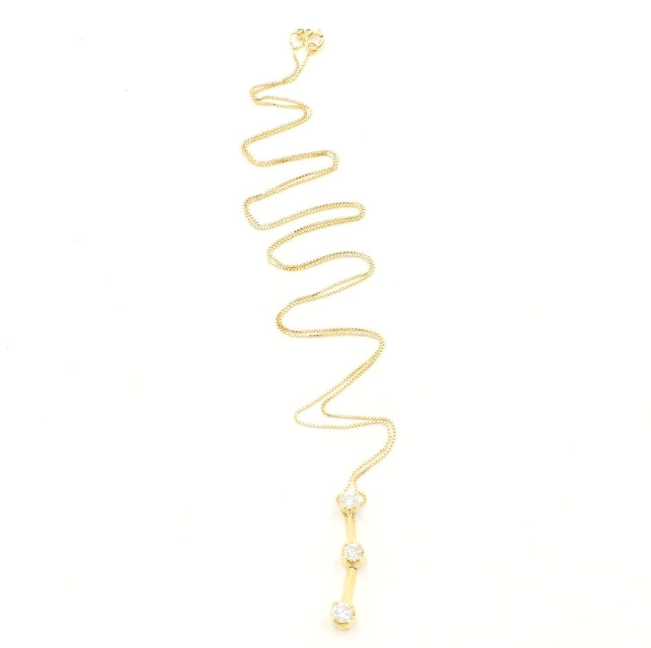 Kent Island Jewelry's Estate 14K gold three-stone vertical diamond drop necklace features a wavy chain.