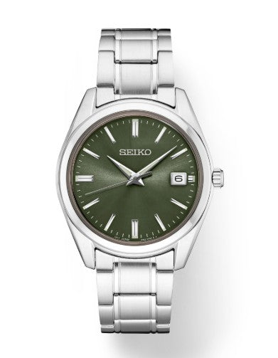 Seiko Essentials SS Quartz Watch with green dial, silver markers, date window, and stainless steel band.