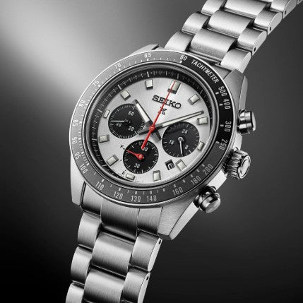 The Seiko Prospex Speedtimer SS Solar has a silver dial, black subdials, and a matching steel bracelet.