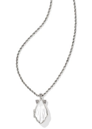 Kendra Scott’s Alexa Locket is a vintage silver plated short pendant necklace with a shell-shaped white charm.