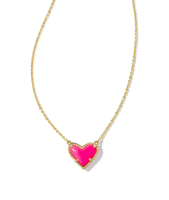 Kendra Scott ARI Heart Short Pendant Necklace in neon pink magnesite, gold outline, on white background.