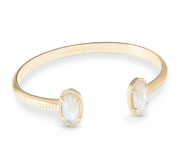 Kendra Scott Elton Cuff Bracelet in gold with ivory mother-of-pearl oval stones and beaded edge detailing.