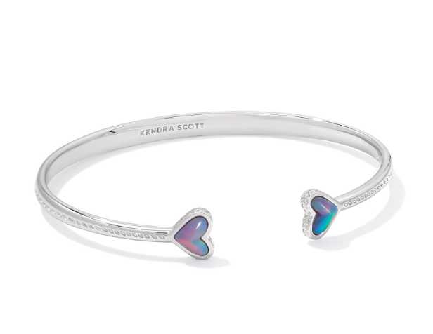 Kendra Scott Framed Ari Heart Cuff Bracelet in silver with lilac opalescent resin hearts and engraved logo inside.