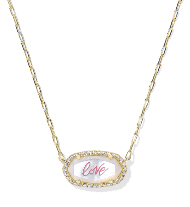 Kendra Scott Elisa gold necklace with ivory mother-of-pearl love script pendant, framed by pave clear stones.