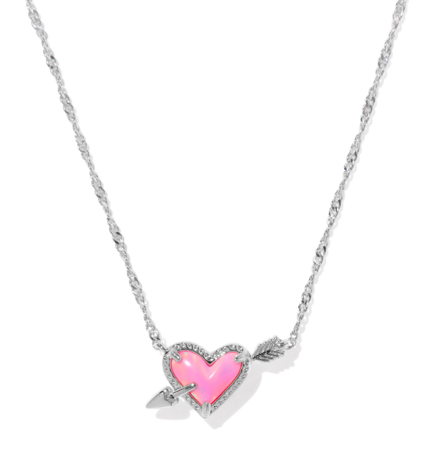 Kendra Scott Ari Heart Arrow short necklace in silver with a pink opalescent resin heart pendant on a twisted chain.