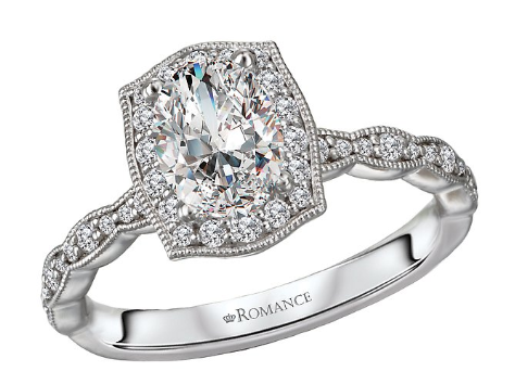 The Romance Halo Semi-Mount Diamond Ring by Romance features a detailed band in 14kt white gold with engraving inside.