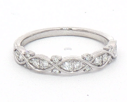 A platinum diamond band ring featuring an intricate openwork diamond pattern, photographed on a plain white background.