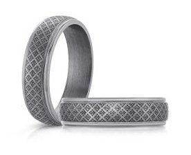 Silver colored laser engraved tantalum ring.