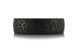 Black and silver tantalum ring with intricate design.
