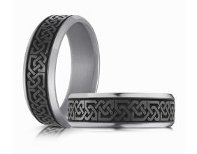 Silver colored Tantalum rings with intricate black Celtic knot designs.