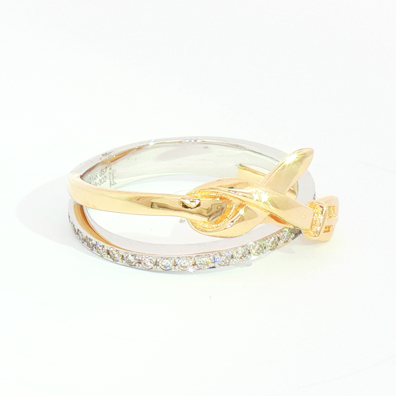 The Heera Moti 14k. Diamond Crossover Fashion Ring pairs gold and silver for a chic, modern look.