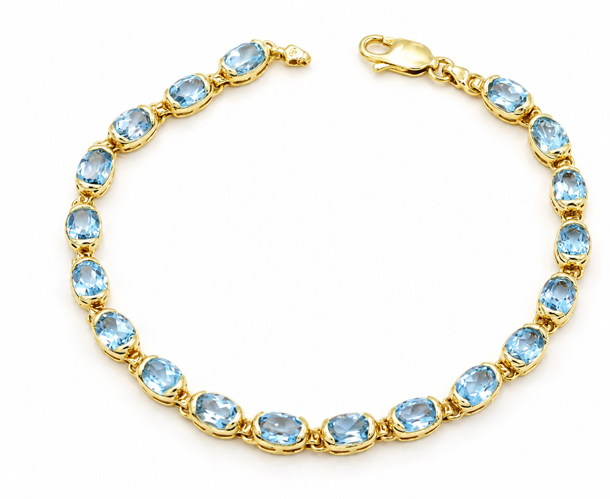 Kent Island Jewelry 14k Yellow Gold Blue Topaz Gemstone Chain Link Tennis Bracelet with oval-cut blue topaz gemstones.