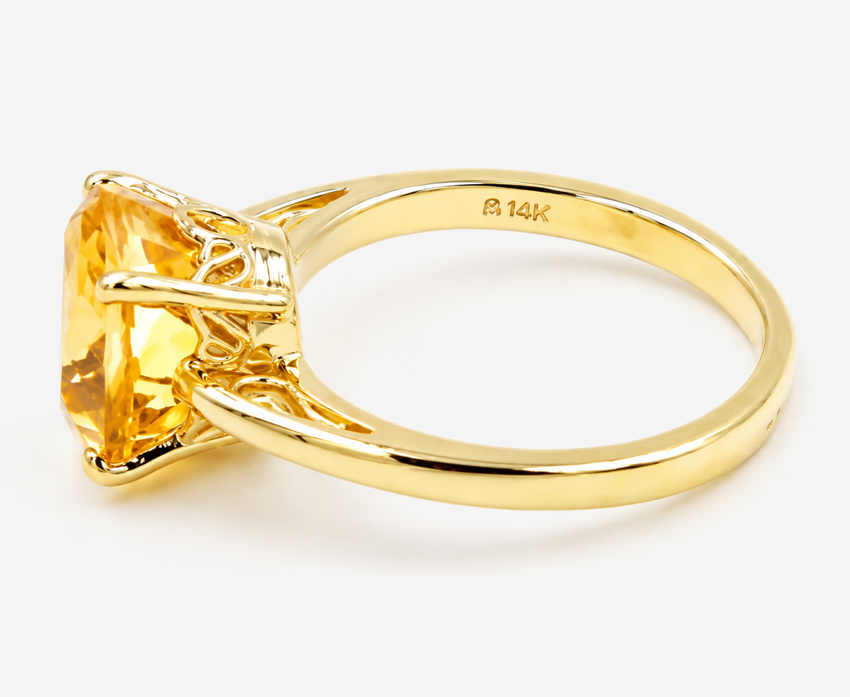 Estate 14k Yellow Gold Citrine Gemstone Solitaire ring featuring a large cushion-cut citrine gemstone.