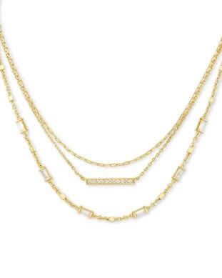 Kendra Scott Addison multi strand necklace in gold features rectangular and bar-shaped accents on each layer.