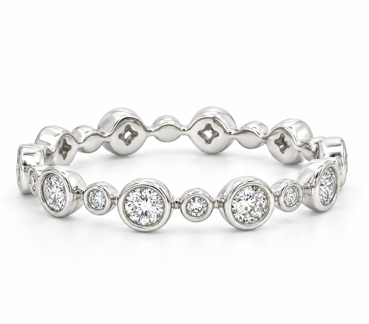 A white gold diamond eternity band featuring a continuous row of round-cut and cushion-cut diamonds in bezel settings.