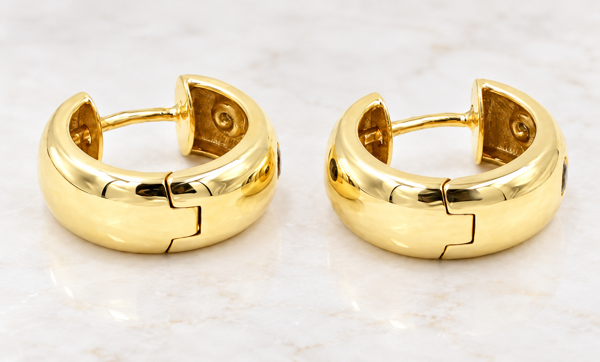 Estate 14k Yellow Gold Diamond Ruby & Sapphire Huggies are two thick 14K yellow gold huggies with embedded multi-gemstones.