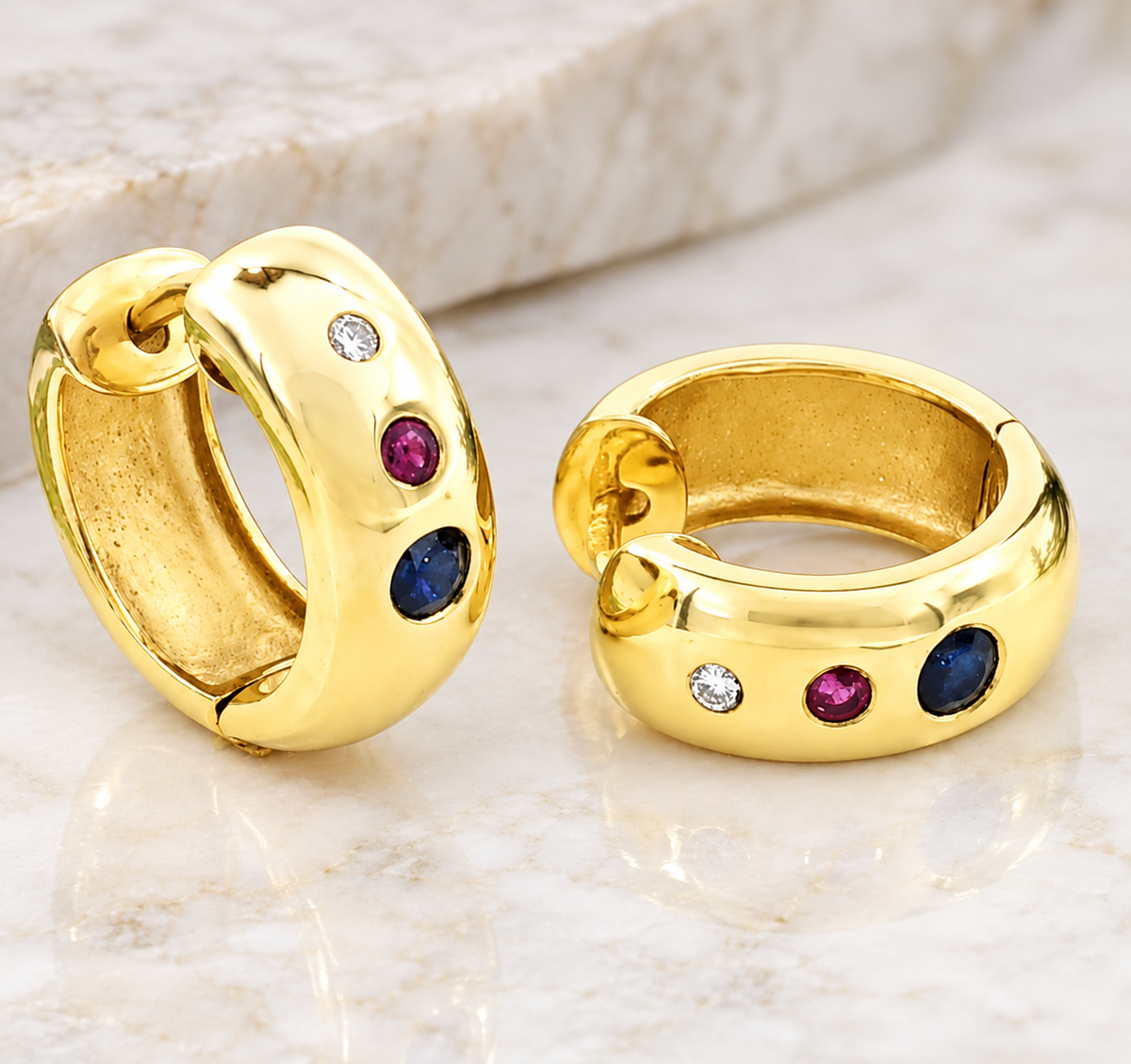 Kent Island Jewelry Estate 14k Yellow Gold Diamond Ruby & Sapphire Huggies, each set with a diamond, a ruby, and a sapphire.