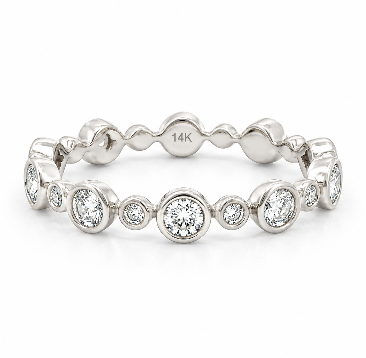 A white gold 14K eternity band ring featuring a series of bezel-set round diamonds, photographed on a clean white background.