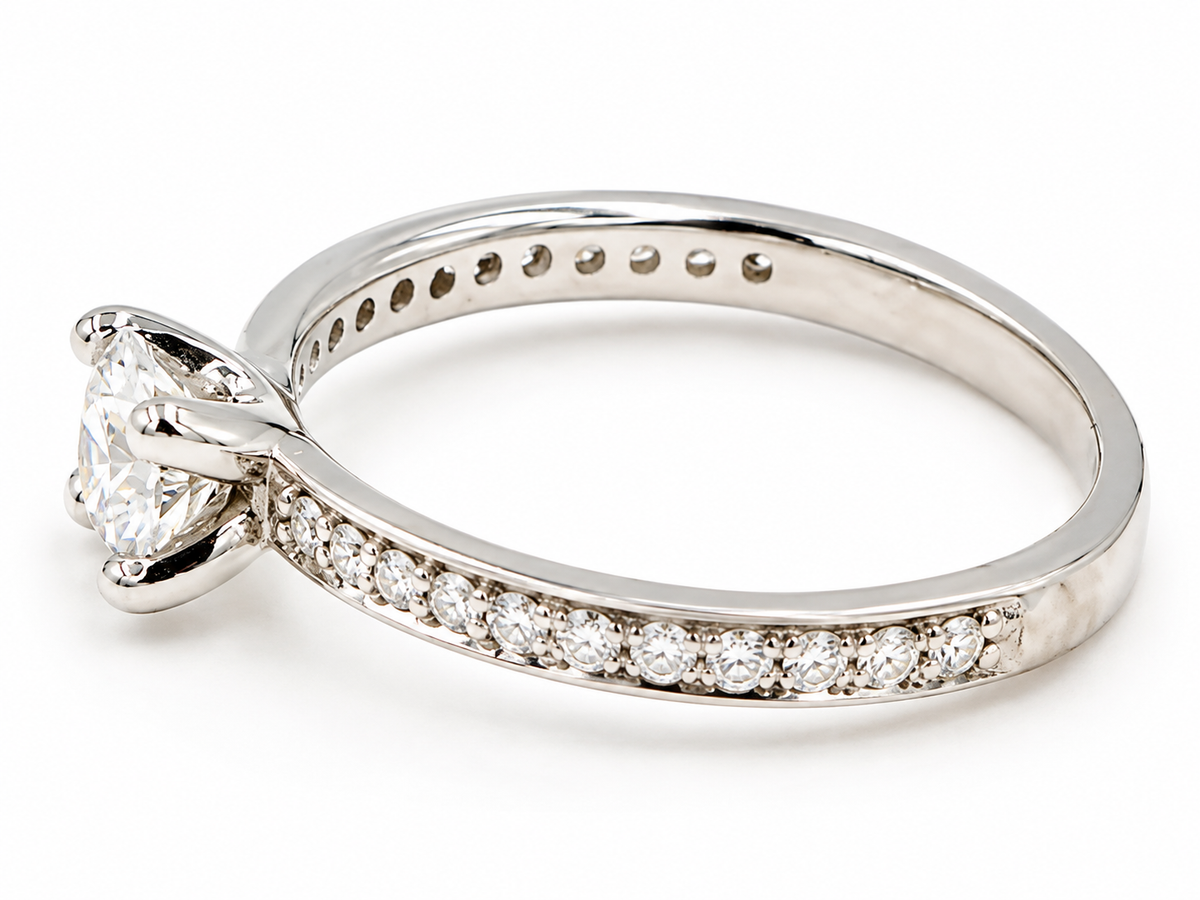 Kent Island Jewelry Estate Platinum .75 tcw Diamond Solitare Ring with a round center stone and accented band.